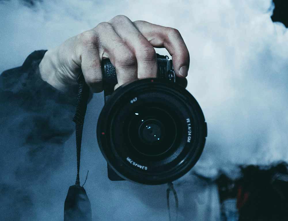 Choosing the right wedding videographer—close-up of a camera in hand, symbolizing professional equipment, technical expertise, and the importance of selecting a skilled videographer to capture your wedding day in Jacksonville and Northeast Florida with clarity, emotion, and cinematic quality.